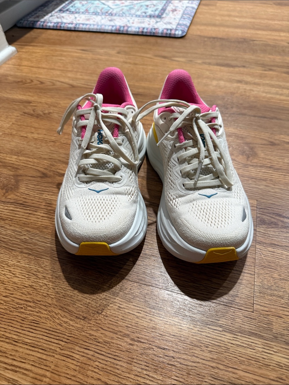 Hoka One One Cream Running Sneakers with Pink Lining and Yellow Accents